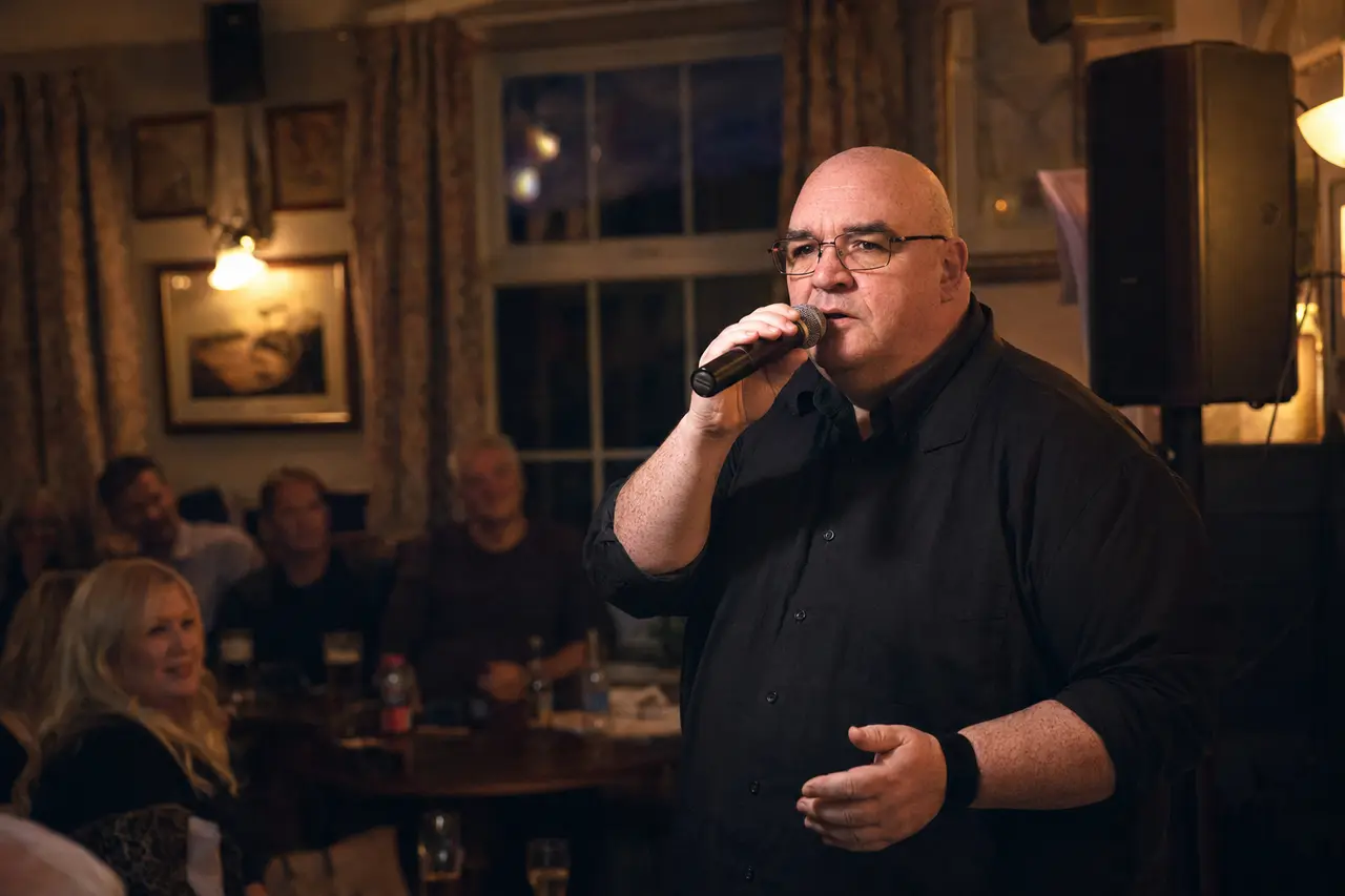 Live singer performing in a pub or social club